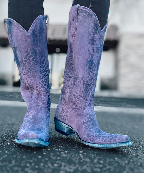 Show off your wild side in these stunning purple leopard print boots.

These gorgeous exclusive 15" boots have been a best seller and are in high demand.  

Old Gringo's classic lines and leopardito leather will pair well with any wardrobe choice, no matter the occasion.  Every Leopardito Boot is unique because of the random patterns of the leather; therefore, consider yourself strutting around in custom cowgirl boots! You'll be comfortable and so stylish in the Old Gringo Leopardito Cowgirl Boots!

Toe:  4L (snip)

Heel:  9964 (traditional)