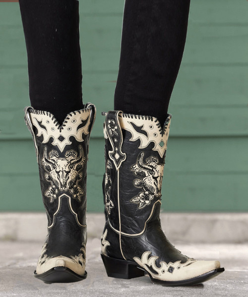 These bold boots channel Billy the Kid and are serving up renegade Wild West vibes with cactus and cow skull embroidery on the shaft, complemented by contrasting leather overlay and trim. Edgy and awesome!