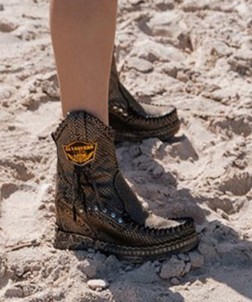 Ezra is one of our moccasin boots characterized by a 7 cm internal wedge, comfortable side zip and handcrafted stitching on the pan. In addition to the leather details and the shy external fringes, Ezra is embellished with elegant side studs. Treated and washed gently with our Silverstone wash which creates incredible color nuances on the suede. Available in this warm autumn color with matching details.

Internal wedge 2 3/4"
Calf suede
Vintage treatment
Handcrafted stitching
Metallic details 100% nickel free
Leather details
Rubber sole
Made in Italy