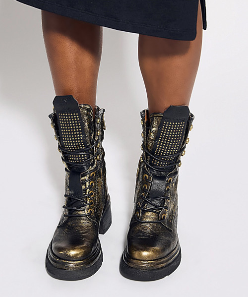 Meet the A.S.98 Emper, a must-have boot for fall! Handcrafted in fine Italian leather and adorned with studded detail along the tongue, the Emper boot brings style to the next level. We love the classic lace-up paired with a comfortable block heel for an edgy-yet-modern look. The addition of the inner zipper detail allows for easy on/off, making this the pair you'll be reaching for all season!

Leather Upper
Leather Lining
Rubber Sole
2.5" Heel
1.25" Platform
7" Shaft Height
10" Shaft Circumference
Measurements are taken from a size 37
Made in Europe