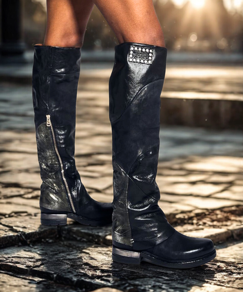 Find your bliss in the A.S.98 Ardie Boot! Accented with subtle hardware detailing, including hammered metallic mini studs, handcrafted patchwork leather, and embossing to boot, these knee high beauties are the perfect boho-inspired pair.