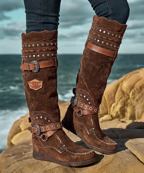 create an image using the first image and have her wearing the boots in the second and third image