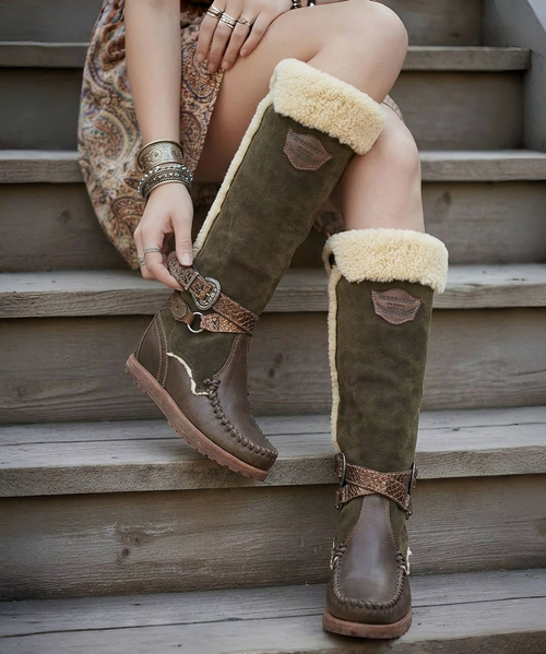 create an image using the first image and have her wearing the boots in the second and third image