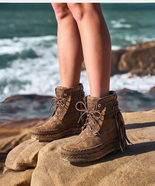 Our Vision moccasin-style boot features a plain over-the-knee bootleg, 2 3/4" hidden wedge, a cool ankle strap and the typical thick handmade stitching on the instep, distinctive feature of El Vaquero brand. Its simplicity gives the Vision boot a timeless elegance. Finished with the renowned Silverstone wash, a milestone of El Vaquero brand, that enhances every shade of leather, showcasing the most intense colors and making each boot unique in its kind.

Hidden wedge 2 3/4"
Vintage Treatment
100% Calf suede
Handmade Stitching
Hand-inserted details
Metal details 100% nickel-free
Rubber sole
Made in Italy