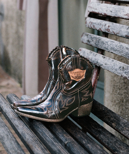 Tanya is one of the marvellous creations by El Vaquero artisans whose main feature is the elegant machine embroidery.
The Tanya boot is also equipped with a comfortable side zip and a 1 3/4" heel. Featuring this wonderful premium cowhide leather with matching details, the new Wanted combination perfectly embodies the essence and style of El Vaquero.
100% Cowhide leather
Metal details 100% nickel-free 
Machine embroidery
Leather sole
Rubber under-heel with logo
Made in Italy Tanya is one of the marvellous creations by El Vaquero artisans whose main feature is the elegant machine embroidery.
The Tanya boot is also equipped with a comfortable side zip and a 1 3/4" heel. Featuring this wonderful premium cowhide leather with matching details, the new Wanted combination perfectly embodies the essence and style of El Vaquero.
100% Cowhide leather
Metal details 100% nickel-free 
Machine embroidery
Leather sole
Rubber under-heel with logo
Made in Italy