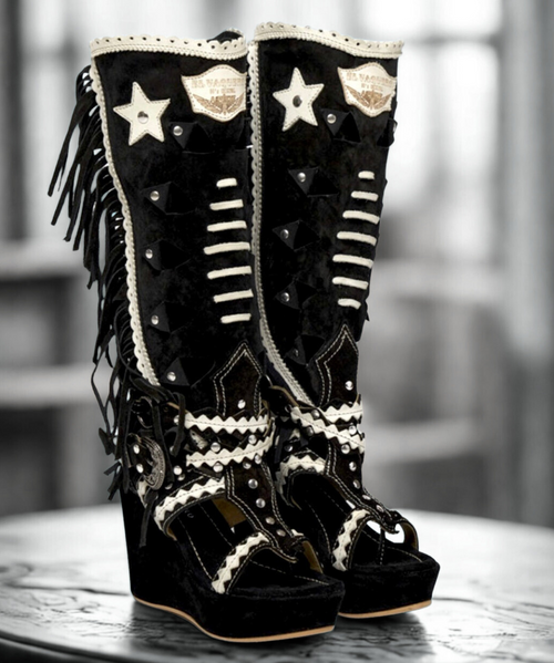 For those who love change, our Ariel is a perfect combination of boot and thong sandal characterized by decorations all over the shaft. The soft fringes on the sides give this model a feeling of movement, while the hand-inserted woven details give it that special, unique look that is so typical of our boots.
Featuring a 3.5" wedge heel and an elegant ankle belt-buckle closure, the mix of leather and natural cowhide make Ariel suitable for any occasion. For those who love change, our Ariel is a perfect combination of boot and thong sandal characterized by decorations all over the shaft. The soft fringes on the sides give this model a feeling of movement, while the hand-inserted woven details give it that special, unique look that is so typical of our boots.
Featuring a 3.5" wedge heel and an elegant ankle belt-buckle closure, the mix of leather and natural cowhide make Ariel suitable for any occasion.