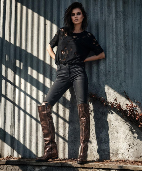 ALSTON Calvados Metallic Knee-High Boots
Elevated. Intentional. Unforgettable. The ALSTON boots redefine classic form with a molten edge. Handcrafted in Italy from smooth leather and finished in a radiant Calvados metallic — a warm, brandy-toned bronze — they deliver quiet drama with every step. The sleek knee-high profile hugs the leg like liquid armor, while subtle metallic glints catch the light, adding depth and movement to the silhouette. Whether layered over denim or paired with tailored skirts, ALSTON is designed to stand tall — and stand apart.

Material: Italian metallic leather, Calvados finish
Color: Burnished brandy with bronze undertones
Height: Knee-high
Fit: Contoured shaft with inner zip or pull-on (specify if needed)
Mood: Sophisticated rebel meets golden-hour glow
Made in: Italy