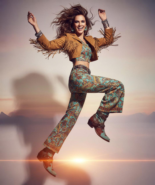 WOW, indeed. The Frontier Trapper Boot by Double D Ranch is a fearless fusion of rugged frontier spirit and runway-worthy style. Handcrafted from distressed turquoise & chocolate with burnished gold veining  leather, this standout boot features a snip toe, cowgirl heel, and bold Western detailing that’s impossible to ignore.
The shaft is a showstopper — accented with studded harness straps, a wingtip design, and eye-catching embellishments like a miniature leather pouch, bandolier, and brass studs along the collar. Whether you're blazing trails or making a statement in the city, this boot is your declaration of independence. WOW, indeed. The Frontier Trapper Boot by Double D Ranch is a fearless fusion of rugged frontier spirit and runway-worthy style. Handcrafted from distressed turquoise & chocolate with burnished gold veining  leather, this standout boot features a snip toe, cowgirl heel, and bold Western detailing that’s impossible to ignore.
The shaft is a showstopper — accented with studded harness straps, a wingtip design, and eye-catching embellishments like a miniature leather pouch, bandolier, and brass studs along the collar. Whether you're blazing trails or making a statement in the city, this boot is your declaration of independence.