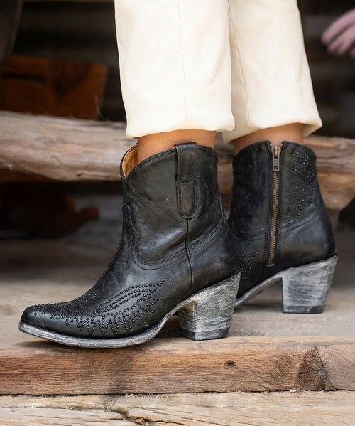 The Clint Boot by El Vaquero is a striking over-the-knee silhouette that blends refined craftsmanship with effortless summer elegance. Distinguished by a sleek ankle strap and beautifully detailed leather accents along the shaft, this boot delivers unmistakable style with a soft, artisanal feel.

Crafted in Italy from a unique combination of luxurious calfskin suede and fine natural linen, Clint offers a fresh, lightweight construction that’s perfect for warm-weather styling. The subtle 7 cm internal wedge provides comfortable lift without compromising ease, while the vintage treatment adds character and depth to every pair.

Finished with handcrafted stitching, nickel-free metal details, and a durable rubber sole, the Clint boot is designed for confident, all-day wear. Elegant yet relaxed, it pairs effortlessly with flowy dresses, tailored shorts, or layered summer looks.

Details:

Over-the-knee boot

Internal wedge: 7 cm

Vintage treatment

100% calfskin suede and natural linen

Handcrafted stitching

Nickel-free metal details

Rubber sole

Made in Italy