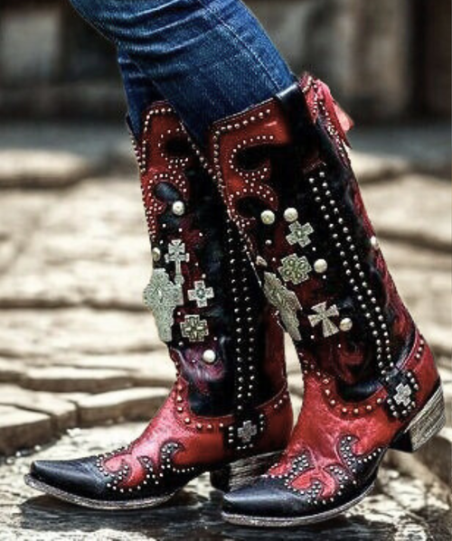 Double D Ranch Ammunition DDL001-1 Boots

The Double D Ranch Ammunition boots are more than footwear — they’re wearable art. Inspired by the spirit of the Southwest, this striking design features rich leather, intricate silver studs, and cross details for a bold, timeless look. A leather lace-up accent runs up the back like a corset, adding a touch of rugged femininity and unmistakable edge.

Whether you pair them with a flowy dress or your favorite skinny jeans, these boots make a statement at every step. Stunning as a fashion piece — and absolutely unforgettable as a bridal boot — the Ammunition is a perfect blend of strength, beauty, and craftsmanship.

Details:

Shaft Height: 16"

Shaft Opening: 14" circumference

Heel Height: 1¾"

Toe: Snip

Width: Standard