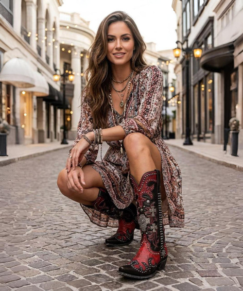 Double D Ranch Ammunition DDL001-1 Boots

The Double D Ranch Ammunition boots are more than footwear — they’re wearable art. Inspired by the spirit of the Southwest, this striking design features rich leather, intricate silver studs, and cross details for a bold, timeless look. A leather lace-up accent runs up the back like a corset, adding a touch of rugged femininity and unmistakable edge.

Whether you pair them with a flowy dress or your favorite skinny jeans, these boots make a statement at every step. Stunning as a fashion piece — and absolutely unforgettable as a bridal boot — the Ammunition is a perfect blend of strength, beauty, and craftsmanship.

Details:

Shaft Height: 16"

Shaft Opening: 14" circumference

Heel Height: 1¾"

Toe: Snip

Width: Standard