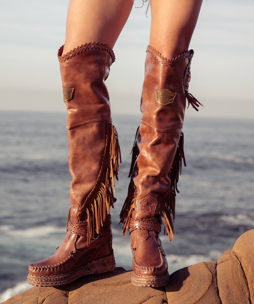 Our Vision moccasin-style boot features a plain over-the-knee bootleg, 2 3/4" hidden wedge, a cool ankle strap and the typical thick handmade stitching on the instep, distinctive feature of El Vaquero brand. Its simplicity gives the Vision boot a timeless elegance. Finished with the renowned Silverstone wash, a milestone of El Vaquero brand, that enhances every shade of leather, showcasing the most intense colors and making each boot unique in its kind.

Hidden wedge 2 3/4"
Vintage Treatment
100% Calf suede
Handmade Stitching
Hand-inserted details
Metal details 100% nickel-free
Rubber sole
Made in Italy