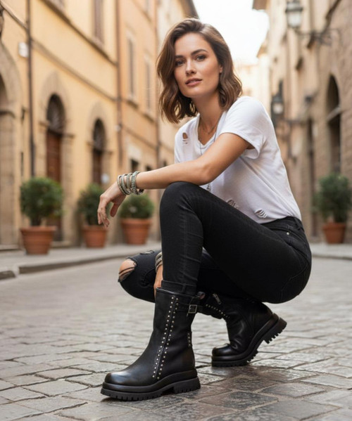 The A.S.98 Duke boot strikes the perfect balance between moto chic and rugged edge! Its simple silhouette is adorned with rounded stud details that frame the seams, topped off with a small adjustable buckle for added flair. The convenient side zipper ensures easy everyday wear, while the comfortable rubber platform provides stability and style, a balanced design that's both practical and polished.


Stand tall in the Duke boot, crafted for those who appreciate quality craftsmanship and grab-and-go style. With their ruggedly refined details, this boot is the best of both worlds!

Details
Leather Upper
Leather Lining
Rubber Sole
2" Heel
1.5" Platform
7.5" Shaft Height
10" Shaft Circumference
Made in Europe