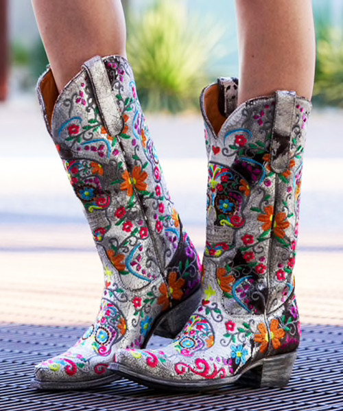 These Old Gringo Klak boots have such an exciting design, you’ll have everyone’s attention when you walk in the room! 
Based off of sugar skulls, traditionally used to celebrate Day of the Dead, these boots have a bright, multi-colored embroidery all over that make the design pop against the sleek eye popping Old Gringo signature distressed leather.
