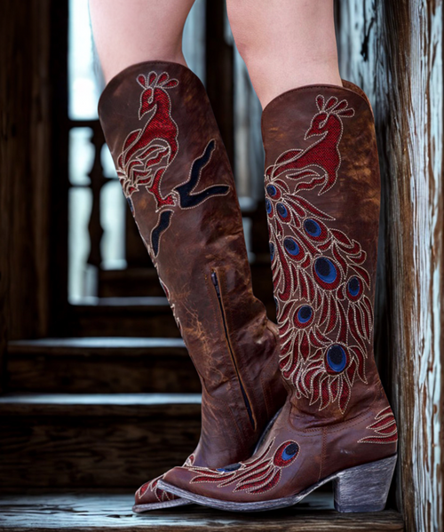 The Peacock by Old Gringo is just right for work or play, the brass leather is adorned with red, blue and black cutouts that create the peacock feather appearance. 