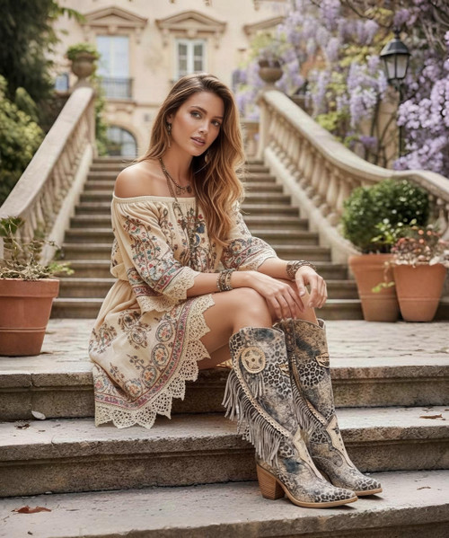 The Kathy Boot by El Vaquero is a stunning mid-calf Texan style designed for women who love effortless elegance with a wild side. Crafted in Italy from luxurious 100% calf suede, this standout boot features a striking marble-effect leopard print that brings depth, movement, and artistic sophistication to every step.

Soft side fringe detailing adds signature El Vaquero flair, while the sleek Texan silhouette and comfortable 7 cm heel create a flattering, easy-to-wear profile. Handcrafted leather details elevate the design, making Kathy perfect for everything from everyday styling to standout evenings out.

Bold yet refined, this boot is a true expression of Italian artistry and free-spirited fashion — made to turn heads and elevate your look with confidence.

Details:

Texan mid-calf boot

7 cm heel

100% calf suede

Marble-effect leopard print

Soft side fringe detailing

Leather sole

Non-slip rubber heel cap

Made in Italy