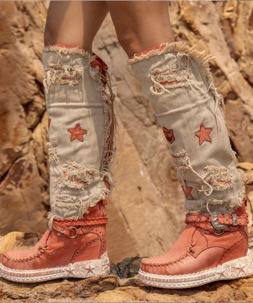 Nash is the new incredible El Vaquero over-the-knee boot with rear laces for an easy fitting. Featuring a prime quality denim and calf leather, the new combo Atomic mixes washing treatments, manual ripping and handmade brush discolouring and it is the most outstanding result of the expertise and skills of El Vaquero craftsmen.

Hidden wedge 2 3/4"
100% Calf leather and Jeans
Handmade Stitching
Hand-inserted details
Metal details 100% nickel-free
Rubber sole