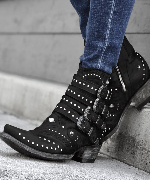 The distressed Vesuvio black leather, buckle accents, and silver stud work is an over-the-top fashion statement. These beauties are finished off with interior side zippers, a snip toe, and easy walking heel. 