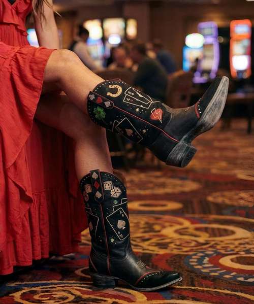Let the games begin with these fabulous Vegas-themed boots! Featuring a sleek black design adorned with playful card game symbols and lucky horseshoes, these boots are perfect for making a bold, stylish statement wherever you go.

OLD GRINGO

Color: Suede Black/Black

Height: 13"