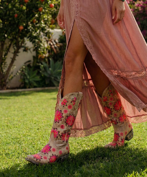 Here's a more elevated, collector-focused product description that fits the **Boot Junky** brand and appeals to Old Gringo enthusiasts.

---

## **Old Gringo Cojin Boots – Style L1369-4**

Some boots make a statement. **The Old Gringo Cojin** tells a story.

One of Old Gringo's most captivating and collectible floral designs, the **Cojin L1369-4** is a true work of wearable art. Produced in limited quantities, this sought-after style has become increasingly difficult to find, making it a prized addition for longtime Old Gringo collectors and those who appreciate exceptional craftsmanship.

Handcrafted in Mexico using Old Gringo's renowned Goodyear welt construction, the Cojin is fashioned from beautifully distressed bone leather that serves as the perfect canvas for its breathtaking embroidery. Oversized floral medallions bloom across the shaft and vamp in rich shades of coral, fuchsia, orange, plum, and chocolate, while coordinating embroidered accents create movement and depth from every angle.

A feminine snip toe and classic Western riding heel complete the silhouette, giving the Cojin a timeless elegance that transitions effortlessly from denim to flowing dresses. Every stitch reflects the artistry and attention to detail that has made Old Gringo one of the most respected names in handcrafted Western footwear.

Unlike more widely recognized styles such as the Mayra or Sora, the **Cojin** has remained a hidden treasure—one that collectors quietly search for and rarely part with. Its limited availability and unforgettable floral design have only enhanced its desirability over the years.

If you're searching for a boot that embodies artistry, individuality, and enduring craftsmanship, the **Old Gringo Cojin** is more than a pair of boots—it's a collectible heirloom destined to be treasured for years to come.

### Features

* **Style:** L1369-4 Cojin
* **Handcrafted in Mexico**
* **Premium distressed bone leather**
* **Goodyear welt construction**
* **Approximately 13" shaft height**
* **Classic snip toe**
* **Traditional 1½" Western riding heel**
* **Oversized multicolored floral embroidery**
* **Collector-favorite Old Gringo design**
* **Limited production style**

---

### **Boot Junky Collector's Note**

*The Cojin is one of those rare Old Gringo designs that becomes more coveted with time. Its vibrant floral embroidery, neutral leather, and limited production make it a standout piece in any collection. For collectors, finding a Cojin in exceptional condition isn't just a purchase—it's a discovery.*

