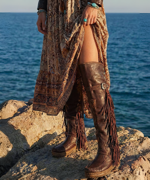 Description
Coleen is an El Vaquero must-have: an over-the-knee boot with a bold attitude, featuring a shaft that rises above the knee and a double shaft construction for a striking, unmistakable look. Handcrafted stitching and iconic side fringe add movement with every step, while the back lacing completes the design with an elegant touch and an adjustable fit.

Details
Internal Wedge 7 cm (approx 2.75 inches)
Vintage treatment
100% buffalo leather
Handcrafted stitching
100% nickel-free metal details
Rubber sole
Made in Italy