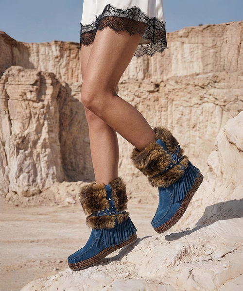 Edith is El Vaquero’s ankle boot with a bold, show-stopping presence, designed for those who love statement volumes and eye-catching details. The style is crafted in soft, washed fur that creates a strong yet sophisticated impact. Side fringe, visible stitching and a strap with buckle strike a balance between character and refinement. The internal wedge ensures comfort and support, making Edith perfect to wear for long hours without giving up the wow effect.
 

Internal Wedge 7 cm (approx 2.75 inches)
Vintage treatment
Washed fur
Handcrafted stitching
100% nickel-free metal details
Rubber sole
Made in Italy