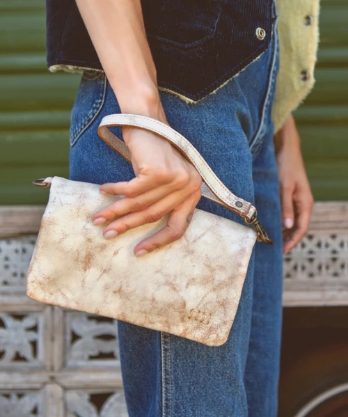 Cadence is a versatile 3-in-1 essential designed to move with you. Crafted from full-grain, vegetable-tanned leather, it transitions effortlessly from wallet to clutch to crossbody with an adaptable strap. Inside, thoughtful organization includes two zippered pockets and dedicated slots for your ID and credit cards, keeping everything neatly in place. Finished with a secure magnetic closure, Cadence makes traveling light feel natural, polished, and entirely uncomplicated.