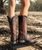 This stunning boot is studded to perfection! We are head over heels crazy about the Old Gringo Raelene Cowgirl Boots! You'll love the versatile color combination of dark chocolate and brass brown leather. The Raelene is decorated throughout with large and small studs that add a seriously cool vibe to a western boot silhouette. Pair them with any outfit during any season for a sultry look!

* Shaft Height - 13"
* Shaft Opening - 14" circum.
* Heel Height - 1.75" 
* Toe - Snip
* Standard Width