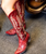 Boots are made for walking AND looking amazing, and the Old Gringo Mayra Boots are SO on trend. These aren't just cowgirl boots; these are fabulous fashion boots. Handcrafted in Leon, Mexico with gorgeous distressed red leather and accented with white embroidery.