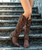 The Old Gringo Belinda Chocolate Boots are a statement in not just the western world, but rock world also! Yes, technically they are cowboy boots, but they are also an awesome pair of fashion boots! The dark distressing on the chocolate brown leather gives the boots a funky, vintage look. Fabulous stud work decorates the entire 18 boot shaft. Interior side zippers will help get the boots on and off. The stacked heels make the boots even more sexy. You will be such a diva strutting around in the Old Gringo Belinda Chocolate Brown Boots!

Measurements:

* Shaft Height - 18"
*
* Shaft Opening - 13 3/4" circum.
*
* Heel Height - 2.5"  Sintino
*
* Toe - Sintino
*
* Standard Width