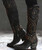 The dark distressing on the charcoal black leather gives the boots a funky, vintage look. Fabulous stud work decorates the entire 18 boot shaft. Interior side zippers will help get the boots on and off. The stacked heels make the boots even more sexy. You will be such a diva strutting around in the Old Gringo Belinda Galaxia Black Boots!