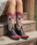 We just can't get enough of the Old Gringo Letty. The midnight black and buttercup gold boot shaft mixes beautifully with the vesuvio pink leather accents. The Letty boot was made for ladies looking to make a bold fashion forward statement. The floral designs on the toe are beautiful and the heart shaped embroidery on either side of the boot shaft gives it a sassy finish. Add the Old Gringo Letty boot to your collection...I can promise you won't be sorry!

Toe - Snip

Heel - 9964 Walking Heel

Vesuvio Black leather foot 

Buttercup leather shaft

red floral inlay on foot

pink leather collar

Leather upper, lining, insole, and outsole

stacked leather western heel

single stitch welt

13 in shaft height