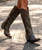 Old Gringo – Diana Boots

This boot grabs attention the second you step into the room. The Diana Boot by Old Gringo blends the best of both worlds—luxurious, high-fashion styling with just the right touch of western attitude.

Crafted from beautifully distressed leather with a vintage, lived-in finish, this tall silhouette creates a long, leg-lengthening line that’s effortlessly striking. Nail head stud accents adorn the shaft, adding subtle edge and modern flair, while the slim European fit offers a sleek, tailored look that hugs the leg in all the right ways.

Finished with a classic snip toe, traditional riding heel, and convenient inside zipper for easy on-and-off, Diana is as wearable as she is unforgettable.

Details:

Brand: Old Gringo

Toe: 4L Snip

Heel: 9964 Traditional Riding Heel

Shaft Height: 18"

Slim European fit shaft

Distressed leather with vintage finish

Nail head stud accents

Inside zipper for easy wear

Sophisticated, striking, and undeniably cool—Diana is where western heritage meets runway-ready style.