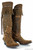 Double D Ranch – Sierra Madre Boots (17" Brass Destroyed Leather)
Straight from the rugged peaks of the North American Cordillera and into the world of Western couture, the Sierra Madre Boots by Double D Ranch for Old Gringo are a true work of wearable art. Crafted from brass destroyed leather, these striking 17" tall boots feature intricate cross-stitch detailing, a bold splash of fringe, and antique silver spots that catch the light — and everyone's attention.

This powerful design seamlessly blends frontier grit with runway-ready elegance, making them just as perfect for a mountain trail as they are for a fashion spotlight. Whether you're collecting or styling, this boot is a statement of craftsmanship, heritage, and fearless individuality.

Details:

Shaft Height: 17"
Toe: Southern (classic snip silhouette)
Heel: 9964 (Traditional Old Gringo heel – approx. 1.625")
Material: Brass destroyed leather
Design Features: Cross-stitch embroidery, fringe accents, antique silver spots