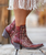AMBER IS A NEW ENTRY INTO THE OLD GRINGO LINEUP AND SHE IS AT THE HEAD OF THE PACK.  THE GORGEOUS RED LEATHER ENHANCED BY INTRICATE BEIGE FLORAL EMBROIDERY SETS THIS BOOT APART FROM THE PACK.  FANCY ENOUGH FOR DATE NIGHT AND LAID BACK ENOUGH FOR EVERY DAY USE, YOU CAN'T GO WRONG WITH THIS BOOT.  THE SINTINO TOE AND HEEL ADD JUST ENOUGH STYLE TO PUT THIS BOOT AT THE FOREFRONT OF WESTERN FASHION.

Measurements:

Shaft Height - 7"
Heel Height - Sintino 
Toe - Snip