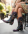 BEAUTIFUL PAIR OF CHOCOLATE LEATHER BOOTS WITH TURQUOISE OVERLAY TOOLING AND TOOLED FLOWERS. THE TWO DIFFERENT COLORED LEATHERS ARE PERFECTLY CRAFTED BY OLD GRINGOS DESIGNERS. THE HAND TOOLING WORK MAKES THESE BOOTS STAND OUT! THESE BOOTS PAIR WONDERFULLY WITH YOUR FAVORITE PAIR OF SKINNY JEANS! BECAUSE OF THE INTRICATE TOOLING DESIGN, THESE BOOTS CAN BE WORN CASUALLY OR ALL DOLLED UP! 

Measurements:

Shaft Height - 18"
Heel - 4 Long
Toe - Snip
