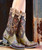 Leather upper features intricate cut outs and overlays that highlight the colorful red flowers, hearts and fall leaves...all put together as a masterpiece of "Art for your Feet". 