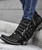 The distressed Vesuvio black leather, buckle accents, and silver stud work is an over-the-top fashion statement. These beauties are finished off with interior side zippers, a snip toe, and easy walking heel. 
