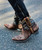 The Old Gringo Polo Chale with Distressed Black shaft styling... Featuring fabulous, intricate, floral hand tooling all over you'll love the shorter, 7" boot shaft, the easy walking heel, the leather braided accents, and chic rounded toe.