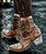 The Old Gringo Polo Chale with Distressed Black shaft styling... Featuring fabulous, intricate, floral hand tooling all over you'll love the shorter, 7" boot shaft, the easy walking heel, the leather braided accents, and chic rounded toe.