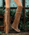 Coleen allows you to explore the world without worrying. 

Its combination of prime quality calf leather and vegetable tanned cowhide guarantees maximum comfort. 

Our vintage treatment, together with hand-stitched raw laces, give this boot a unique touch complemented by indomitable fringes and an elegant side buckle.

Available in this gorgeous Cortina Tobacco brown colour, Coleen is the perfect travel buddy.

2 3/4" Internal wedge heel

1 1/2" wedge sole

Leather logo tag

Stitching details

Unlined

Rubber sole

Made in Italy

Composition: 100% Calf