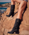 Kaleesi is one of our tallest boots, with a beautifully decorated over-the-knee boot leg. Featuring the typical moccasin construction with thick handmade stitching, soft side fringes, leather embellishments and star-shaped metallic elements, Kaleesi stands out for its originality and elegance. 

Internal wedge 2 3/4"
Handmade stitching
Vintage Treatment
Handmade details
Metal details 100% nickel-free
Leather details
100% Laminated Leather
Made in Italy
