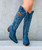 Italian made with Italian leathers and old world workmanship these boots are made for walking AND looking amazing. The El Vaquero Miya Boots are SO on trend. These aren't just cowgirl boots; these are fabulous fashion boots. Handcrafted in the Tuscan Valley with gorgeous distressed Azul Blue Italian leather and accented with cream & silver embroidery. We love the tall, 18" silhouette and snip toe of the Miya Boots. Whether you rock them during the Holiday Season or for date night, we know you will look AMAZING and turning heads in the Miya Azul Blue Italian Leather Boots!
