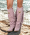 Katherine Boot by El Vaquero

A true bestseller from El Vaquero, the Katherine boot stands out with its exquisitely detailed double shaft design. This striking boot features a 2 3/4" heel, flowing side fringes, distinctive metal accents, and intricate leather decorations that gracefully wrap around the ankle.

Each pair is finished with El Vaquero’s signature Silverstone wash, a hallmark of the brand. This artisanal treatment brings out the richest tones of the leather, ensuring that every boot has its own unique character—no two pairs are ever exactly the same.
