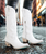 She's the perfect chic, white cowgirl boots right off the runway. 

This classic snip toe is accompanied by an abstract cosmic starburst pattern and retro inspired toe stitch. Level up your wardrobe with this blue bottom hottie.
