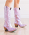 She's the perfect chic, lavender metallic cowgirl boot right off the runway. 

