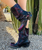 Short, ankle to mid calf, distressed black fuchsia, moto biker style boot with heel buckle embellishment