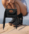 Absolutely — for Boot Junky, I would make the description more **luxurious, concise, and customer-focused**, while adding clear **U.S. sizing information**. Since this is a handbag, I assume you mean **U.S. measurements converted from the Italian/metric measurements**, rather than shoe sizing.

### El Vaquero Daria Fringed Suede Bag

A true expression of **Italian craftsmanship and Western spirit**, the new **El Vaquero Daria Bag** combines luxurious calf suede, flowing fringe and signature El Vaquero detailing into a beautifully distinctive everyday bag.

Designed to be carried **by hand or worn crossbody**, the Daria features soft, cascading side fringe and striking nickel-free metal embellishments that add just the right amount of Western attitude. The bag is finished with El Vaquero's iconic **Silverstone wash**, a signature treatment that enhances the natural character and rich color variations of the leather. Because of this artisan finishing process, **each Daria bag is unique and one of a kind**, with its own individual variations in color and texture.

Made in Italy from **100% calf suede**, the Daria is the perfect size for carrying your everyday essentials while adding an unmistakable **Italian-meets-Western flair** to any look.

### PRODUCT DETAILS

* **El Vaquero Daria Bag**
* 100% genuine calf suede
* Made in Italy
* Signature El Vaquero Silverstone wash
* Soft side fringe detailing
* Decorative 100% nickel-free metal accents
* Leather shoulder strap
* Wear **by hand or crossbody**
* Magnetic button closure
* Each bag is unique due to the artisan leather finishing

### DIMENSIONS

* **Height:** 14 cm / **5.5"**
* **Width:** 19 cm / **7.5"**
* **Depth:** 6 cm / **2.4"**

### A LITTLE ABOUT EL VAQUERO

Since 1975, **El Vaquero** has represented the perfect marriage of authentic Western inspiration and Italian craftsmanship. Every piece is created with carefully selected materials and traditional artisan techniques that celebrate the natural beauty and individuality of leather.

The result is a collection that doesn't simply follow trends — **it tells a story.**

**Boot Junky Style Note:**
Wear the Daria crossbody with jeans and your favorite El Vaquero boots for an effortlessly cool Western look, or pair it with a flowing boho dress when you want to make a statement. The fringe, rich suede and Silverstone finish make this a gorgeous addition to any **Western, Boho or Free-Spirit wardrobe.** ?✨
