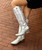 Immerse yourself in western style with our ALLIE Silver Cracked Leather boots. These elegant boots not only provide a touch of glamour but also stand out with subtle 

embroidery on the shaft and toe, adding a touch of sophistication and authenticity to your outfit.
Measurements:

Shaft Height - 17"
Heel Height - 2" 
Toe - Round Pointed
Standard Width