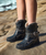 create an image using the first image and have her wearing the boots in the second and third image